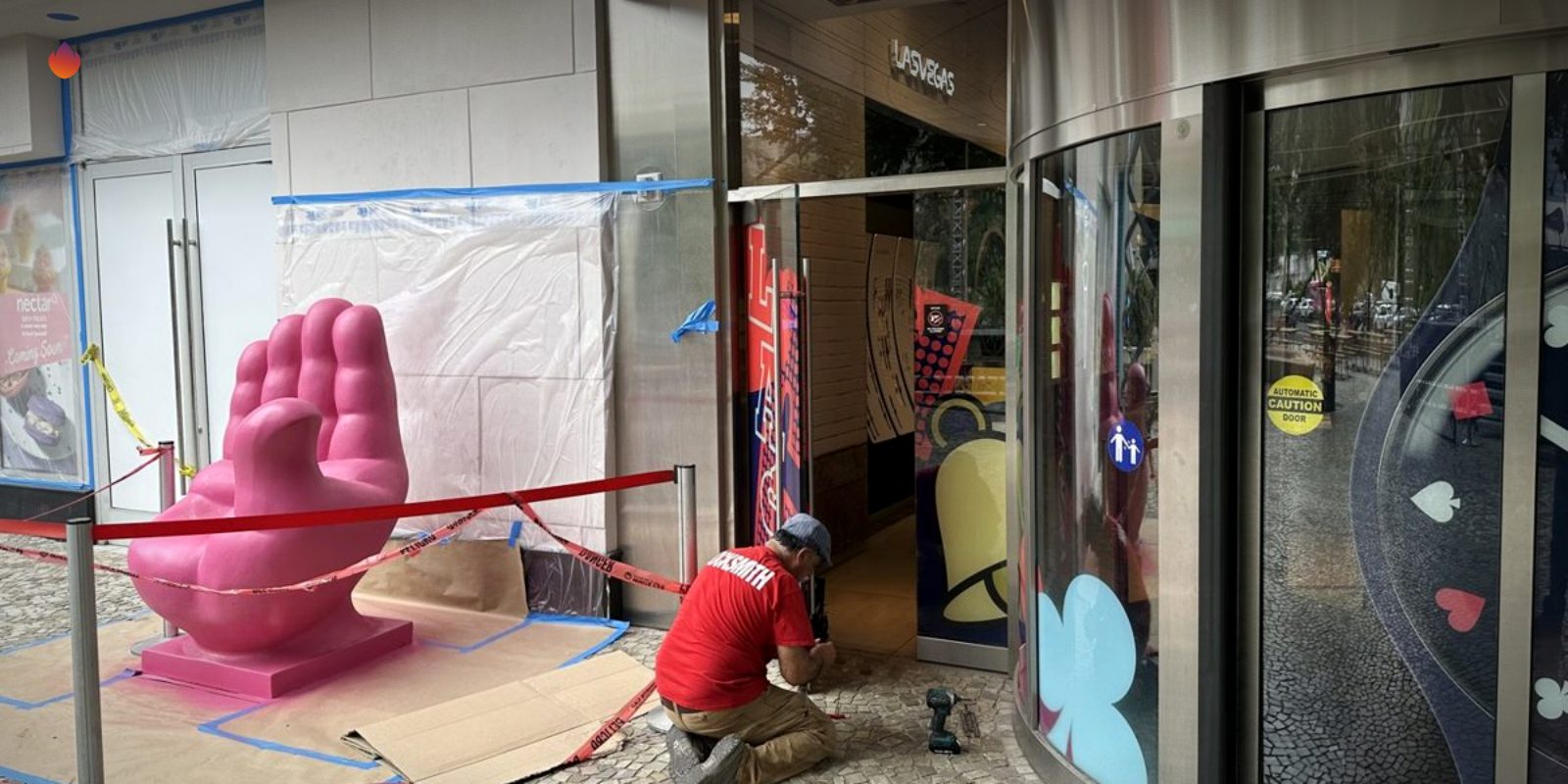 A Silver State Locksmith tech working on a storefront door on the Las Vegas Strip