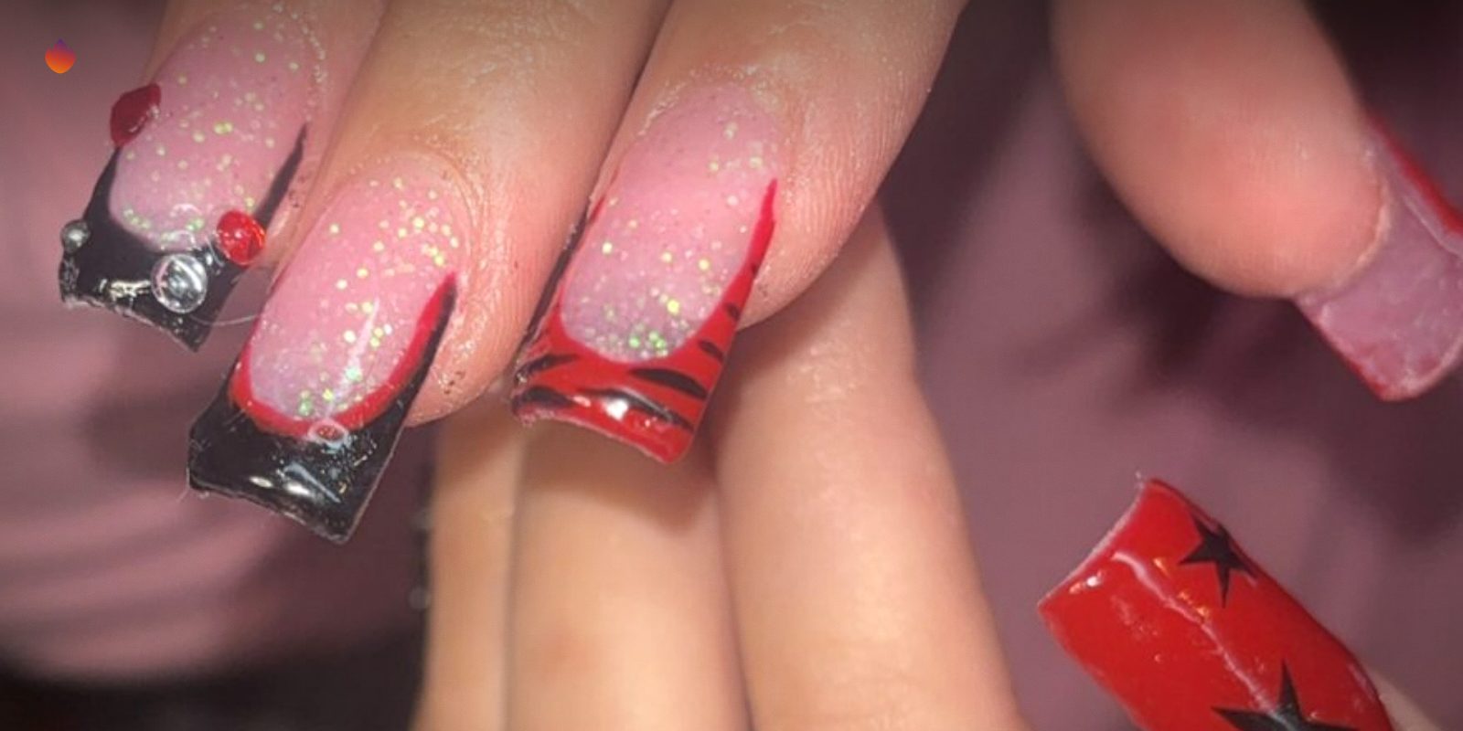 A set of red and black nails with small bows