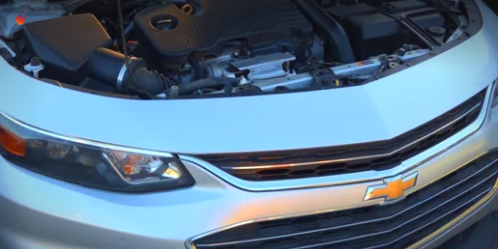 A Chevy Malibu with its hood up at the curb for a Supercanic street call in Jurupa Valley