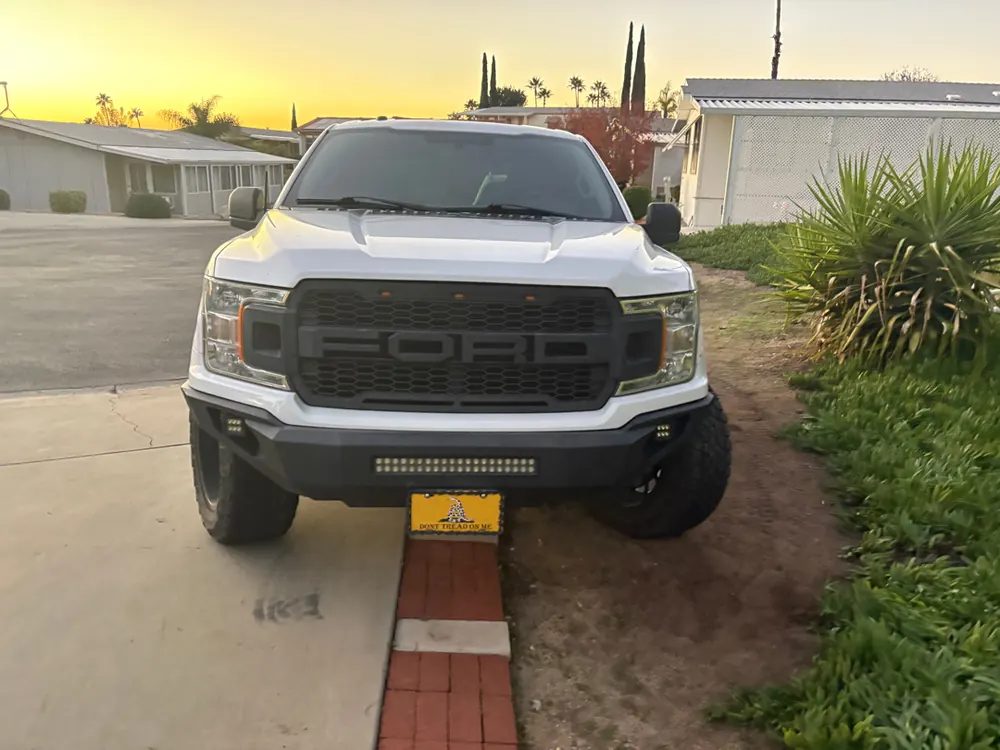 A Ford F-150 diagnosed at sunrise in a Hemet, California driveway