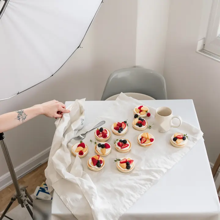 Styling pastries with a reflector for a cafe menu shoot