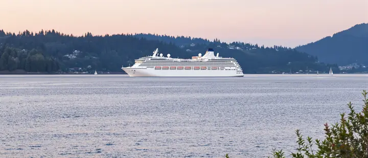 A ship heading out of Bellingham Bay at sunset