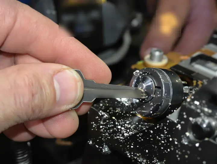 Cutting a new key blade on the key machine in the van