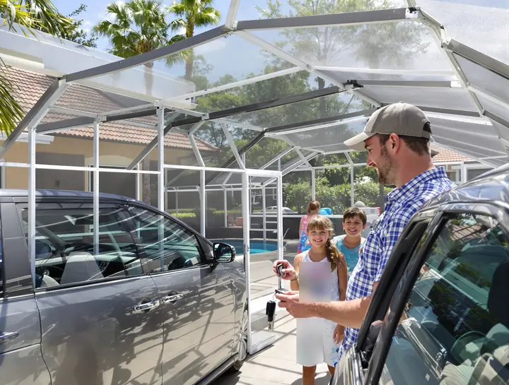 Handing a new key to a family at a Kissimmee vacation home