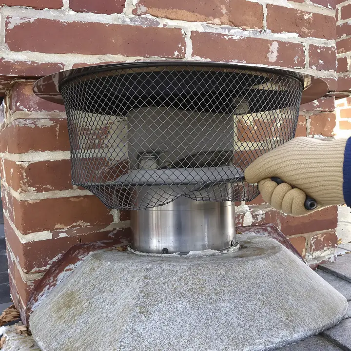New stainless cap on a brick chimney in Glastonbury