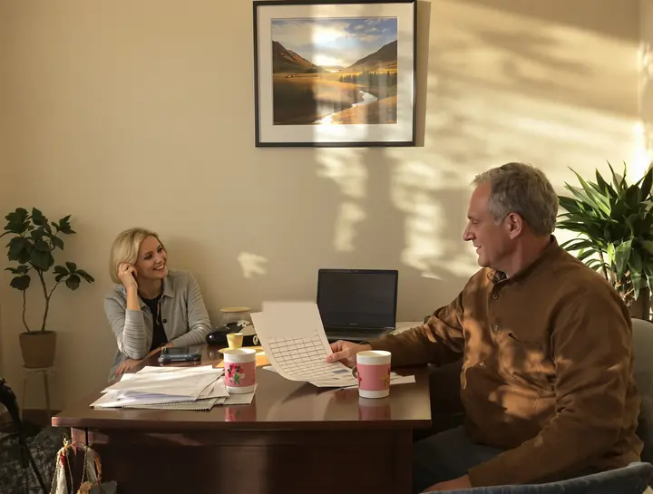 Admissions advisor going over a class schedule with a new student