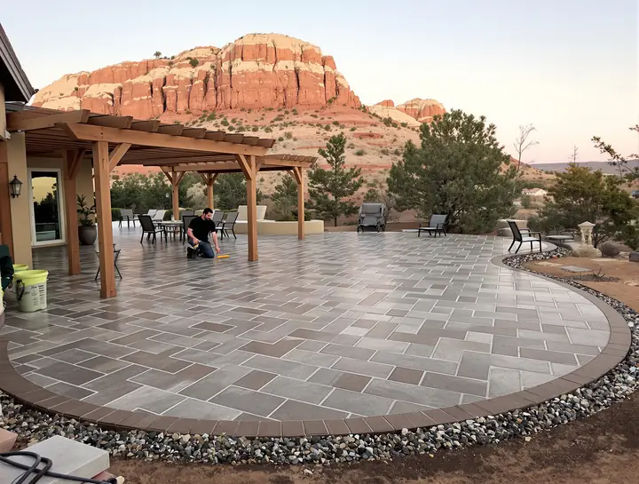 Stamped slate pattern patio with a pergola in Ransom Canyon