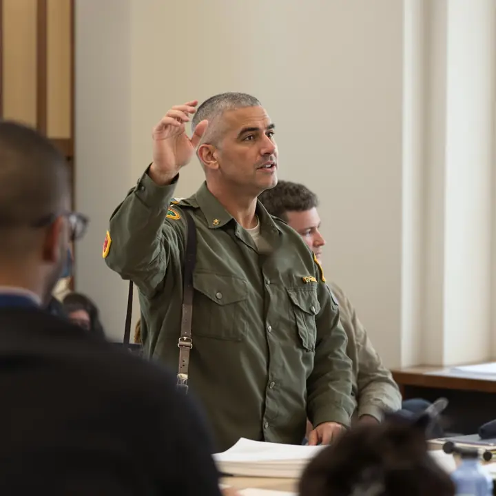 A veteran asking a question in a small seminar
