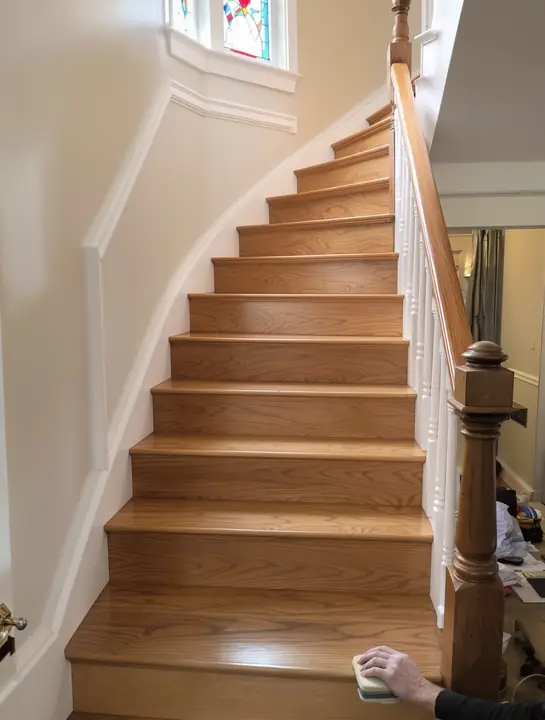 Refinished oak stair treads with white risers in a Victorian home