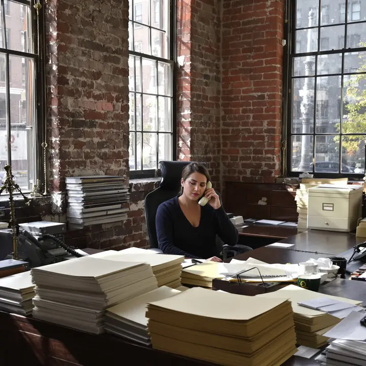 Our intake paralegal on the phone at the Walnut Street office