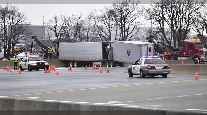 Tractor trailer stopped on the shoulder of I 95 with police on scene