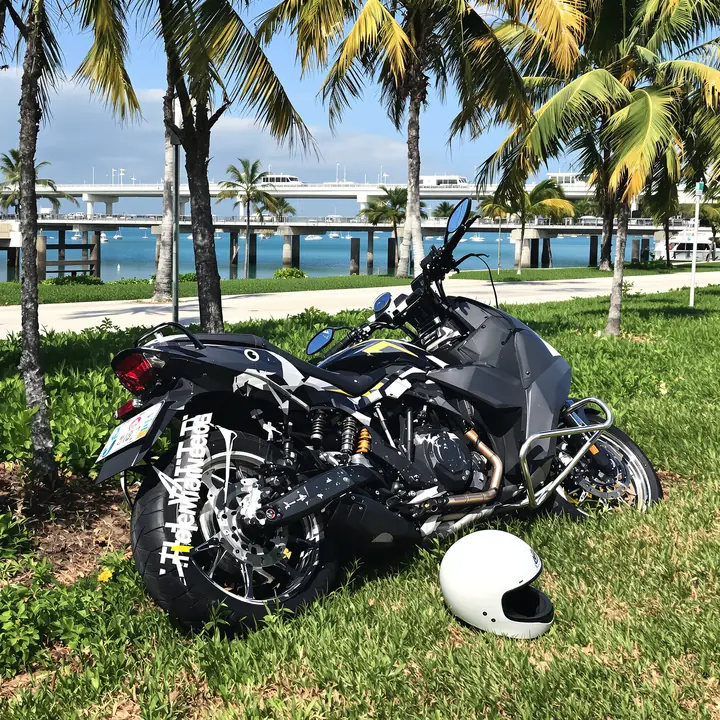 Motorcycle down in the grass beside the Rickenbacker Causeway