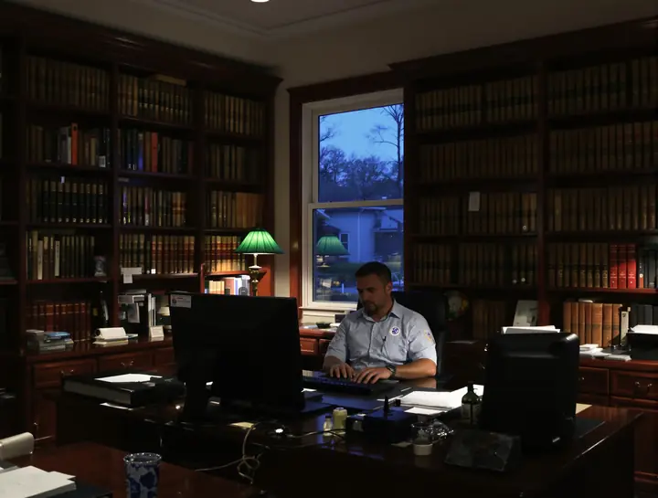 Evening updates at a small Athens law office after the staff has gone home
