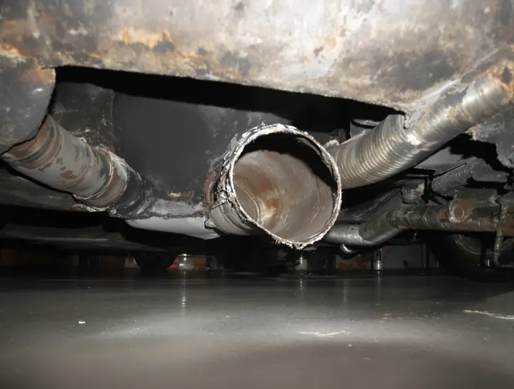 Cut exhaust pipe where a catalytic converter was stolen