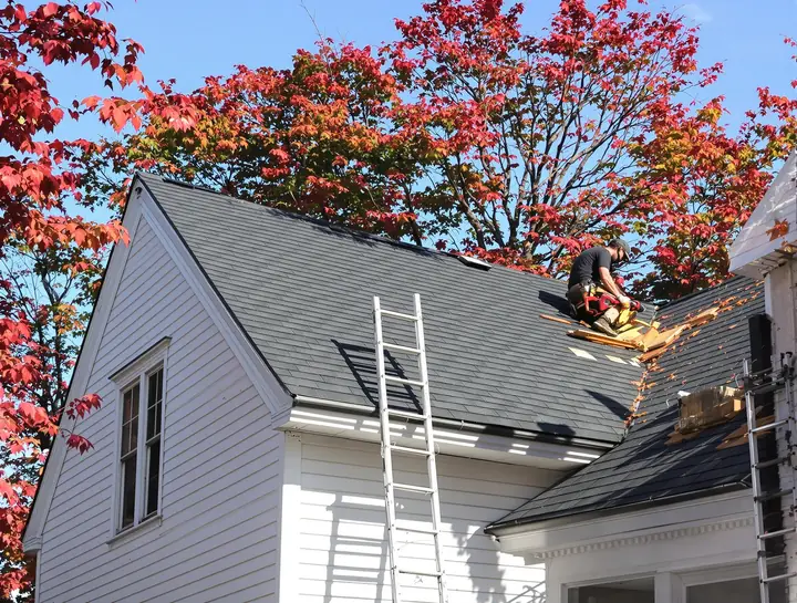New shingles going on a cape in Hampden before the snow
