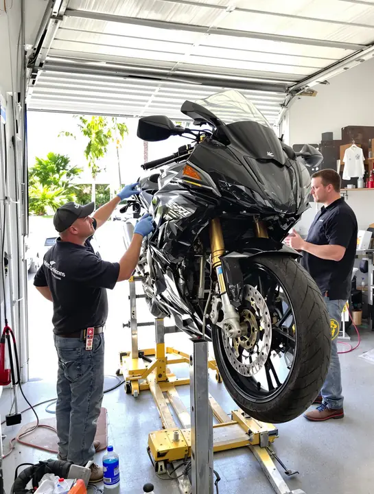 Mechanic showing a bent front wheel to our investigator in a Port Orange bike shop