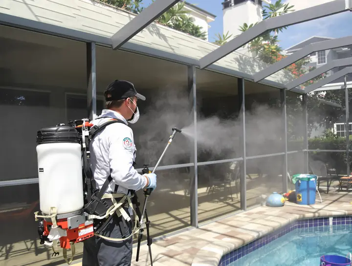 Tech treating a screened lanai