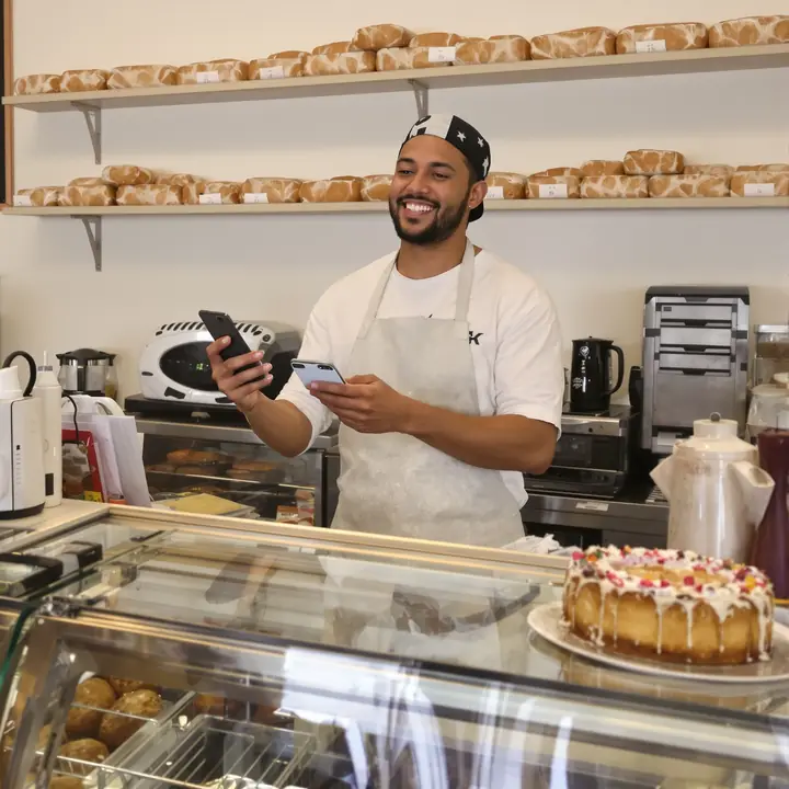 Tap to pay at a neighborhood bakery counter during king cake season