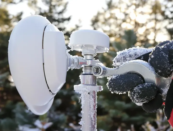 Tightening the dish mount on a frosty morning