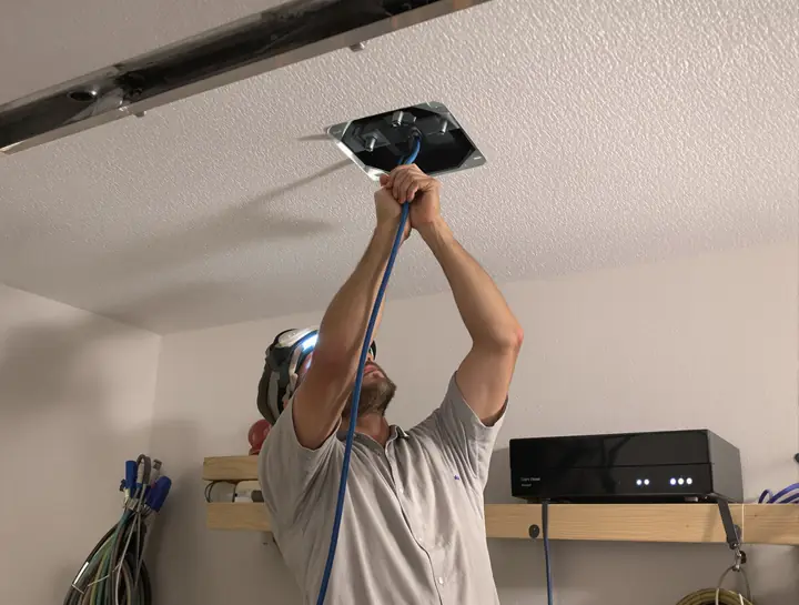 Running network cable through the garage ceiling to the camera recorder
