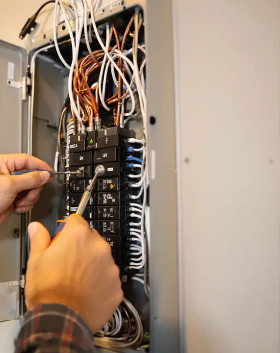Electrician wiring a backup loads panel