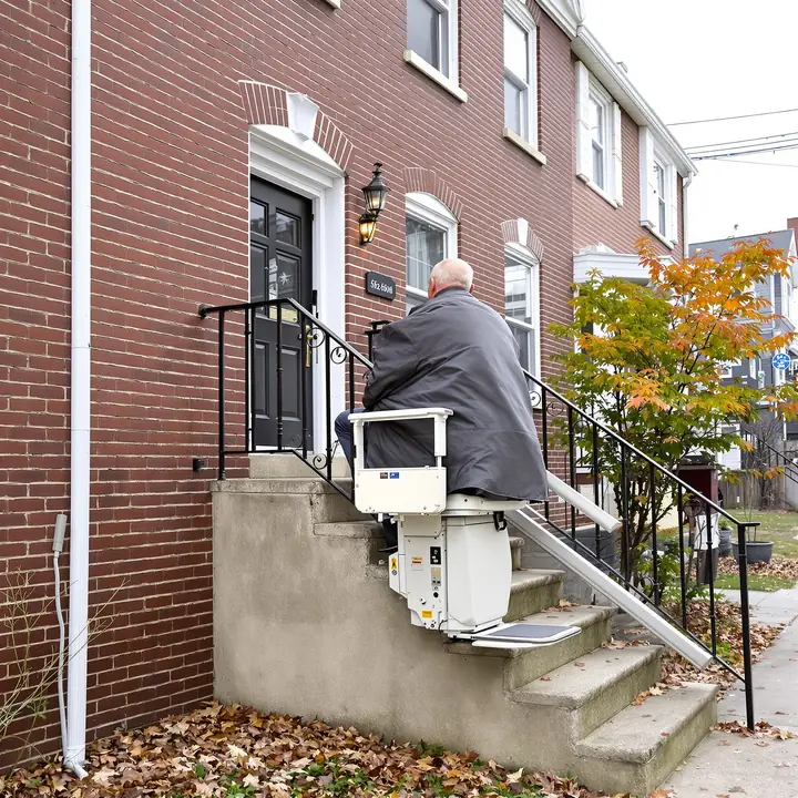 Outdoor stairlift on the front steps of an Allentown rowhome