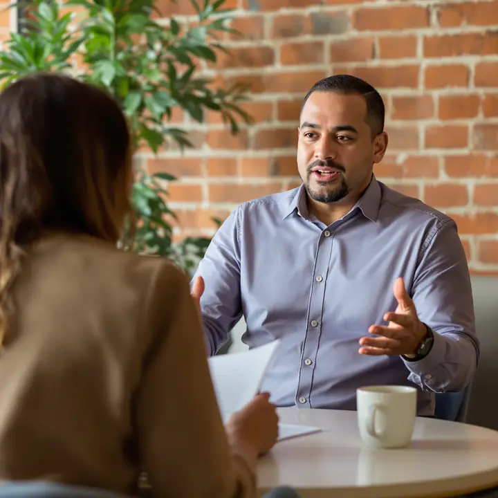 Counselor explaining payment counts to a social worker