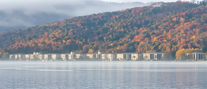 Table Rock Lake on a misty fall morning with resort buildings on the far shore