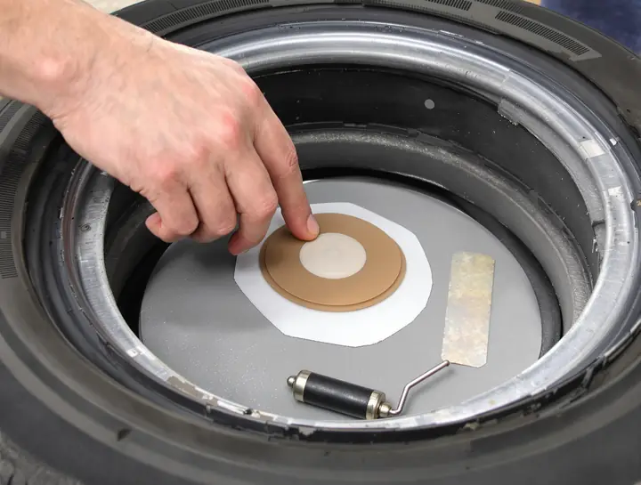 Plug patch going in from the inside of a tire