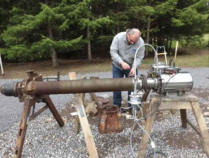 Old rusty submersible pump beside its new stainless replacement near Rathdrum