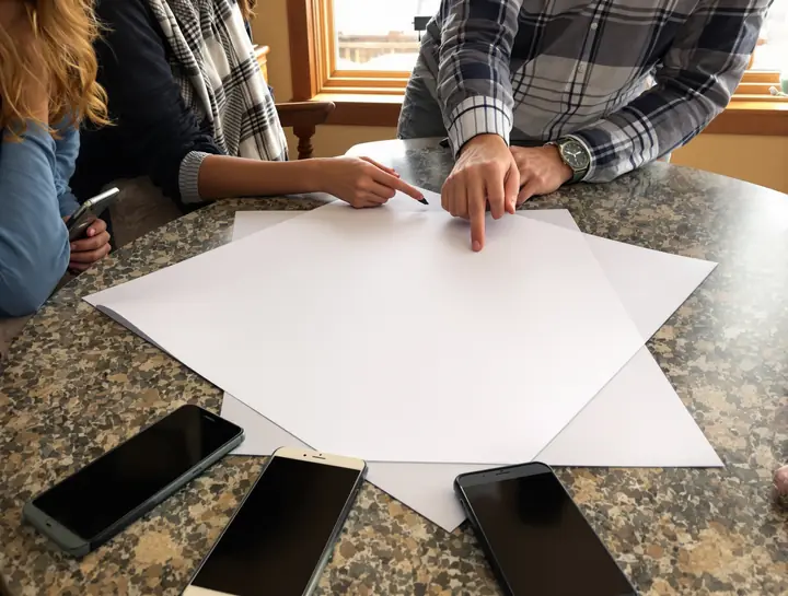Going over a five line bill with a mom and her son at their kitchen table